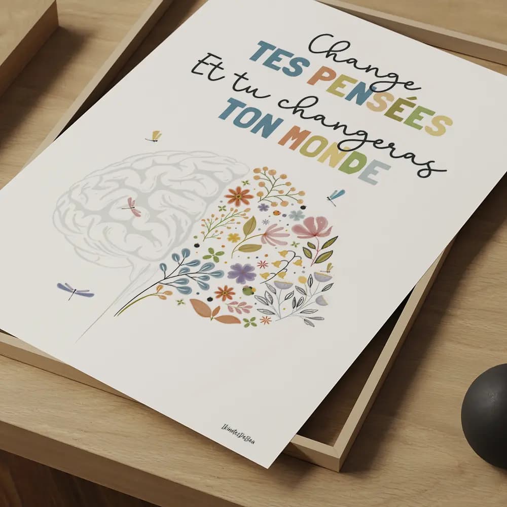 Belle illustration de cerveau floral, ornée de fleurs éclatantes et délicates, avec des libellules gracieuses posées dessus et autour. Le message "Change tes pensées et tu changeras ton monde" inspire à voir la beauté et le potentiel de transformation en chacun de nous.