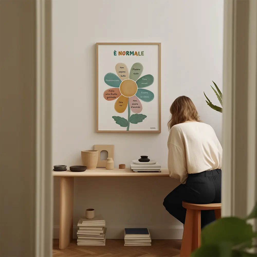 Fleur ressemblant à une marguerite multicolore dessinée en aquarelle avec un message écrit sur chaque pétales en italien